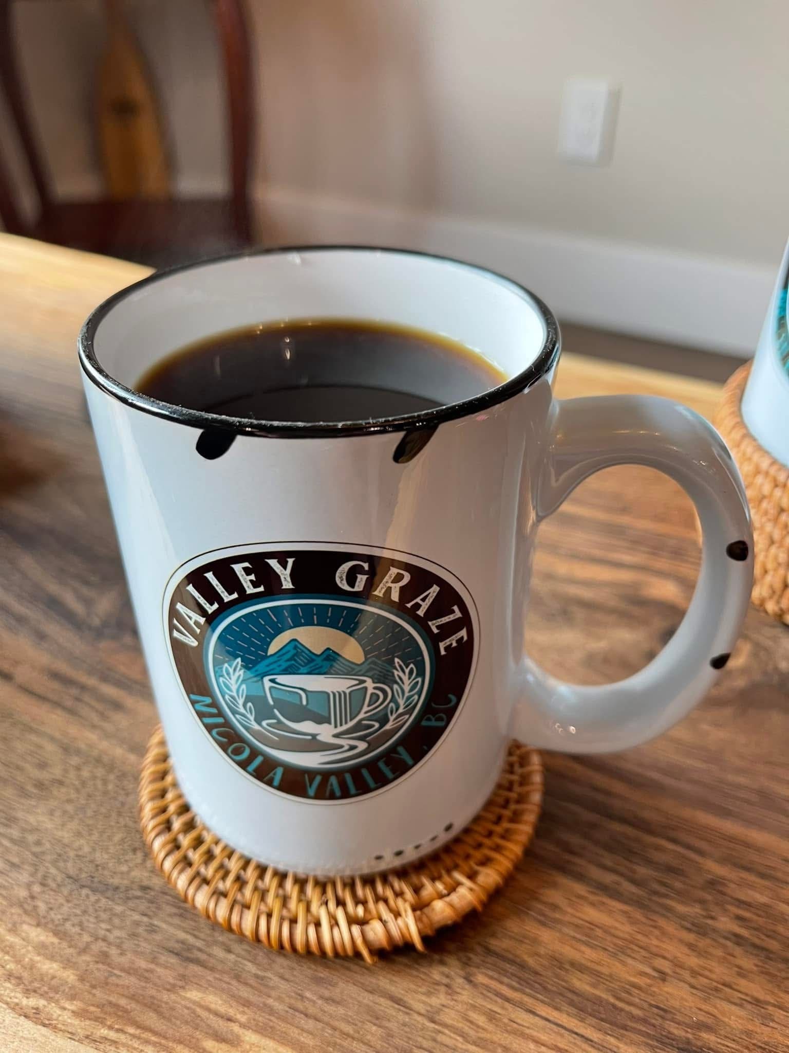 valley graze custom mug with coffee in it on a table